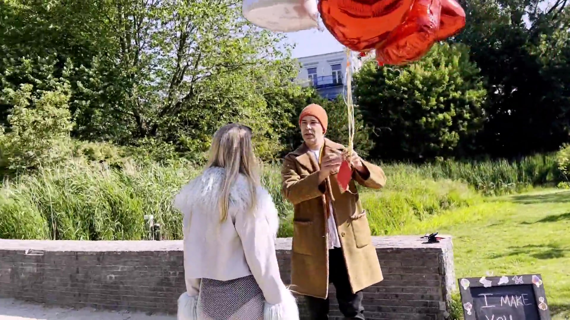 The first encounter, under a bouquet of balloons
